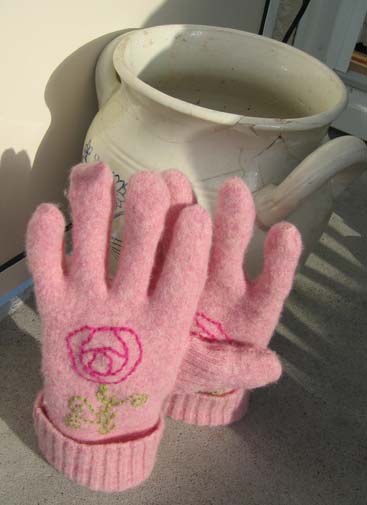 Pink wool gloves made from recycled and felted wool