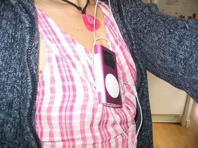 The spanking new pink iPod clipped to my dress