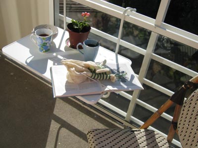 My balcony table with the knitting and coffee ready for crafting (Photo copyright H. Andersson)