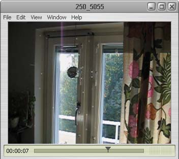 Click this picture to see the movie in AVI of prisms from sunshine coming in (Photo copyright H. Andersson)