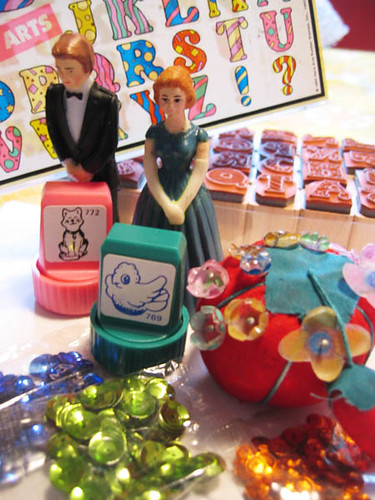 Inside the Super ShrinkyDink packet was many cute little things like stamps sequins letter stamps marriage couple in plastic