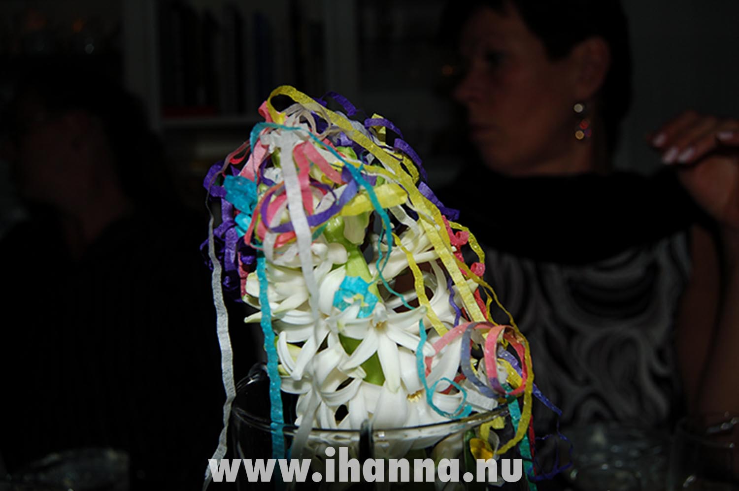 New Years party popper landed on a white flower on the table (Photo copyright Hanna Andersson)