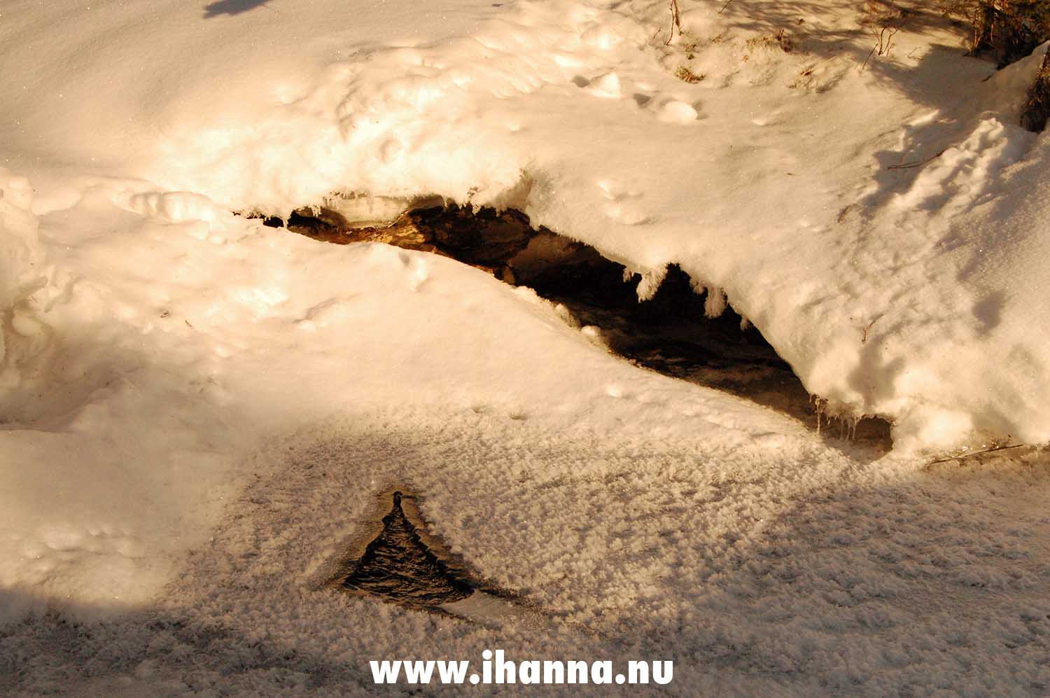 Snow covered water gaping open to the running water beneath - Photo copyright Hanna Andersson