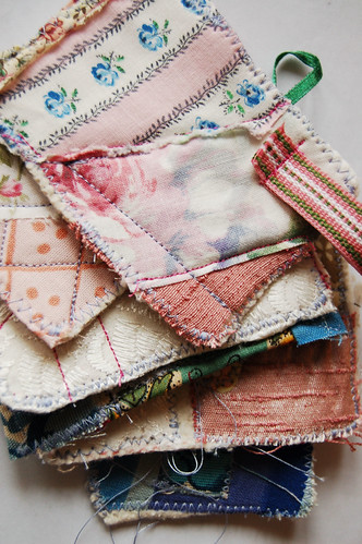 Pile of fabric ATC artist trading cards sewn by iHanna 2006 (Copyright Hanna Andersson)