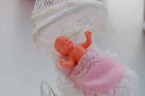 Baby doll in  very small perambulator thrifted by me (Photo copyright Hanna Andersson)