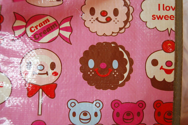 Close-up of Cram Cream pink Candy pattern bag 