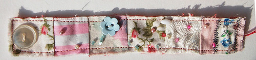 Fabric bracelet by iHanna using beads, buttons, fabric scraps (Photo copyright Hanna Andersson)