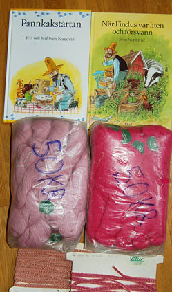 Pink wool yarn and Findus children's books thrifted in Sweden at Umeåkers loppis
