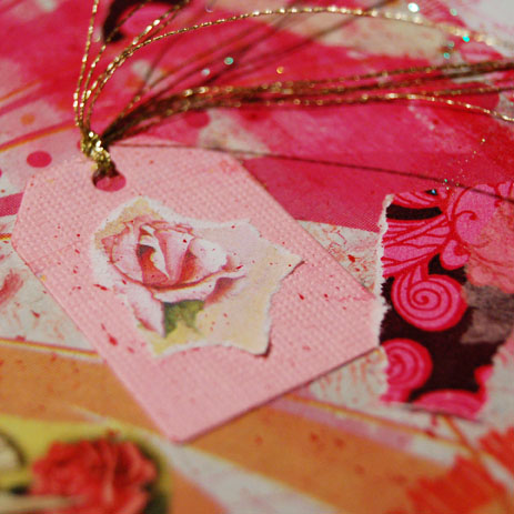 Tiny pink tag with illustrated rose image glued on