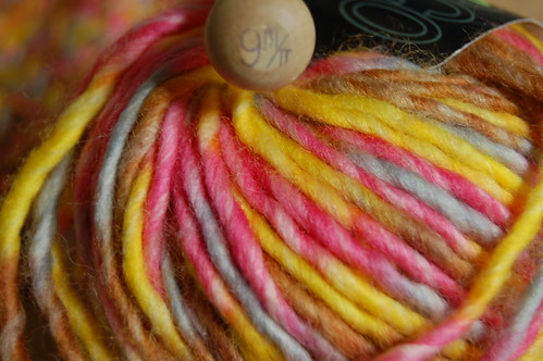 My yarn Jazz is pink, gray and yellow and my knitting needle size 9
