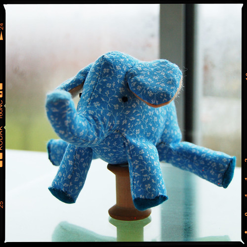 Tiny Elephant softie balancing on a spool by iHanna
