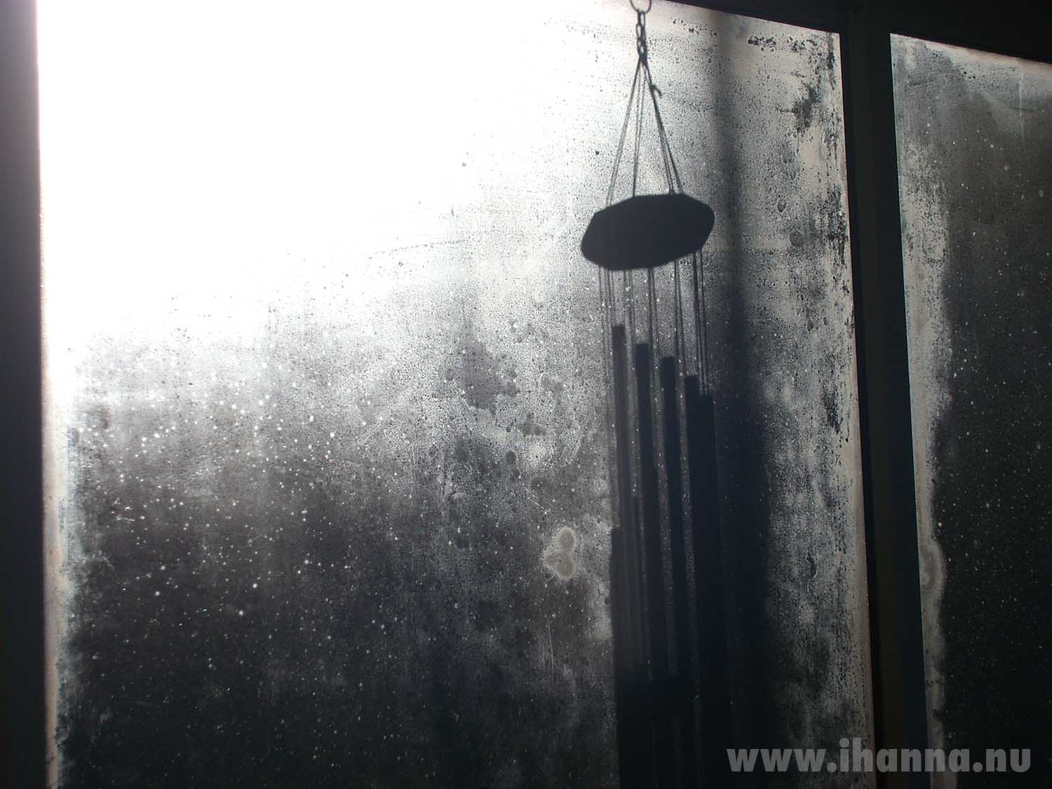 Window photo with the shadow of a wind chime by iHanna - Photo Copyright Hanna Andersson