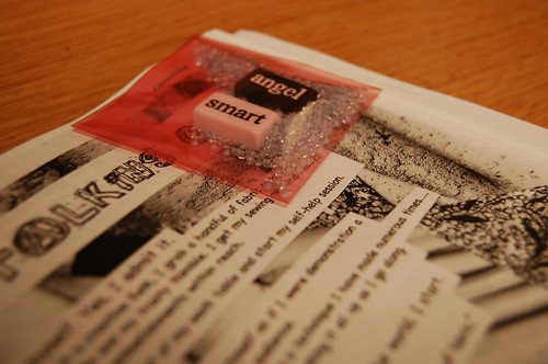 Alma's zine with inclusion stapled into it