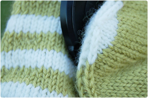 Holding with knitted mittens by iHanna (Photo copyright Hanna Andersson)