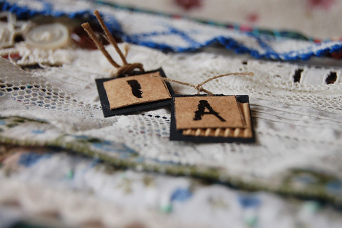 Art Quilt - detail of my grandma tribute quilt with Paper tags with her initials on I A for Inga Andersson (Copyright Hanna Andersson)