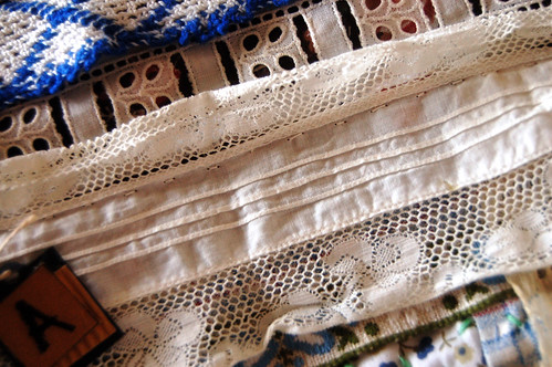 Art Quilt - detail of my grandma tribute quilt with Paper tags with lots of white thrifted lace (Copyright Hanna Andersson)