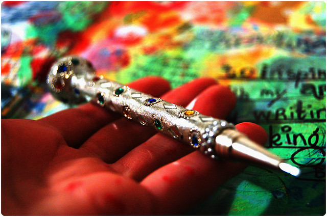 Writing is magic Art Journal page and blinged ball point pen in my hand (copyright Hanna Andersson)