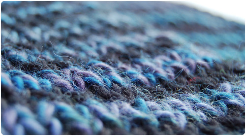 Close up on striped scarf (copyright Hanna Andersson) From a simple scarf knitter Close up on striped scarf (copyright Hanna Andersson)