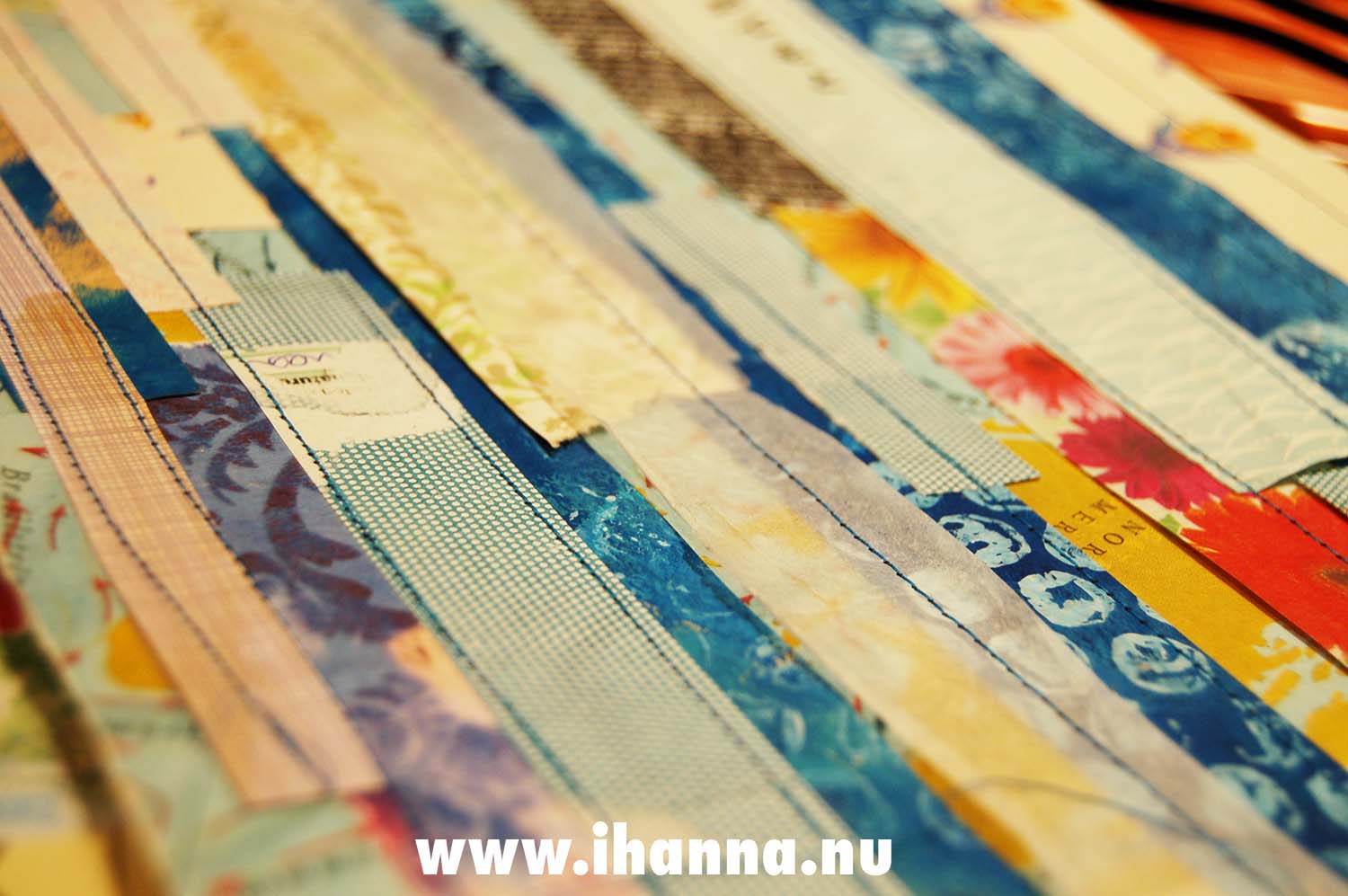 Blue and neutral colors together on sewn mixed media papers (Copyright Hanna Andersson)