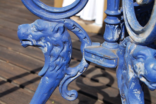 Blue lion heads on the garden table and shadows 2010 (Photo copyright Hanna Andersson)