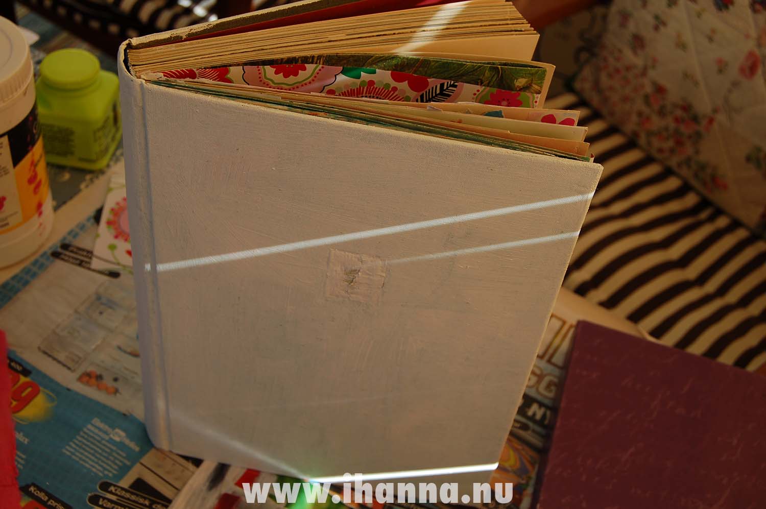 Art journal by iHanna filled with gesso and a few collage papers it's a start (Photo and altered book tutorial copyright Hanna Andersson)