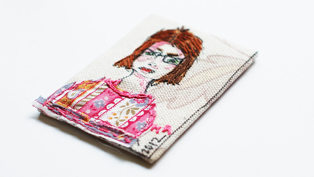 Self portait on fabric ATC with embroidery (Copyright Hanna Andersson)