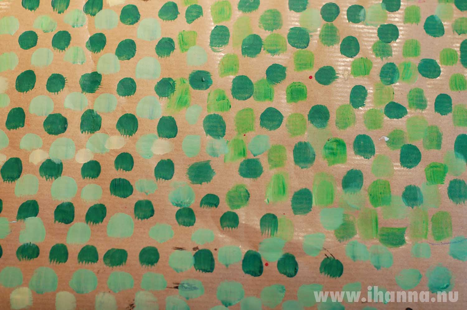 Filling the view with green polka dots on brown paper (Copyright Hanna Andersson)