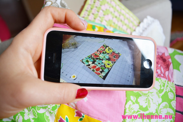 My hand holding my iphone where I am watching a quilting tutorial on YouTube (Photo copyright Hanna Andersson)