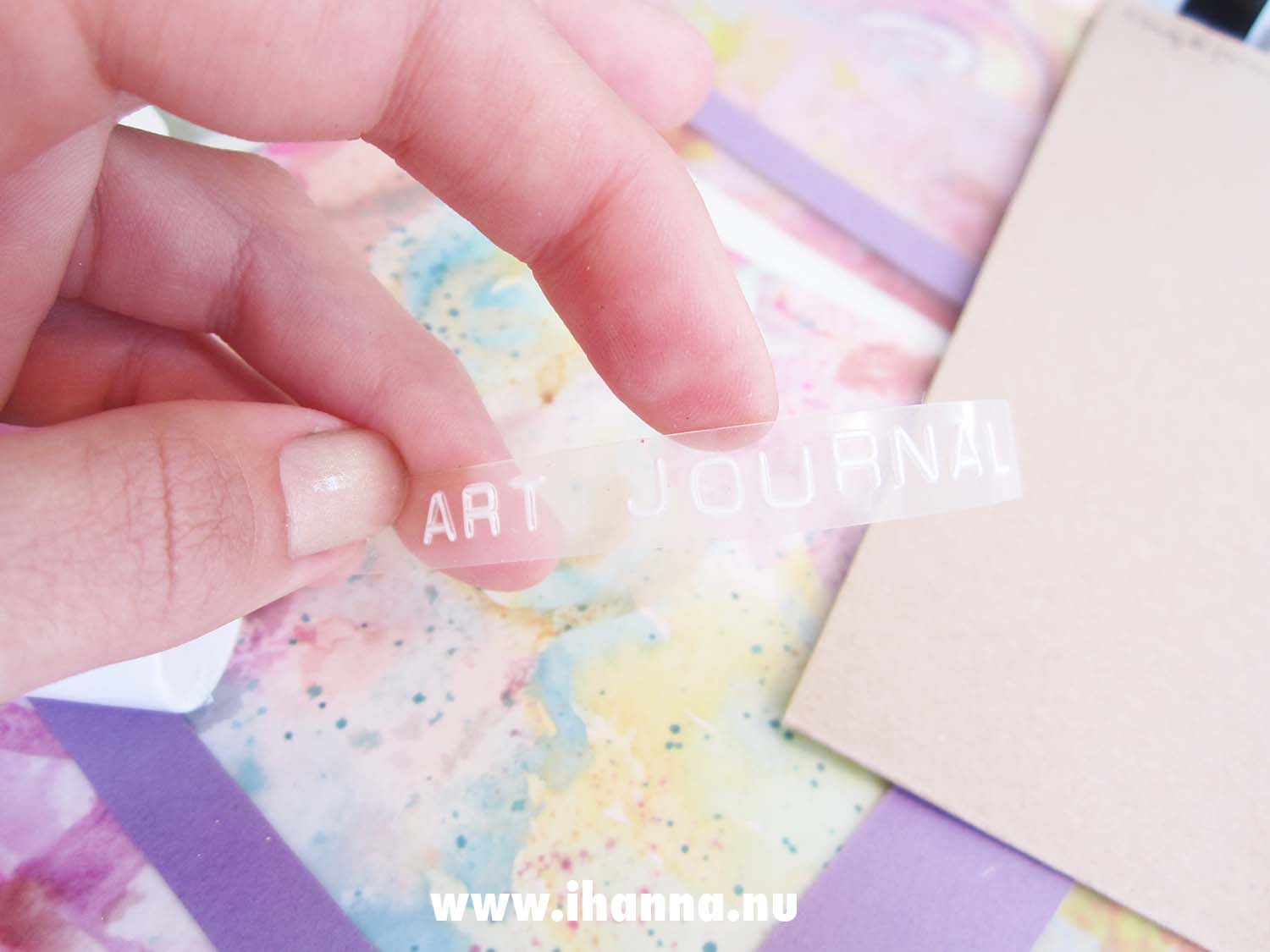 Transparent dymo label with the typed text Art Journaling (Photo copyright H. Andersson)