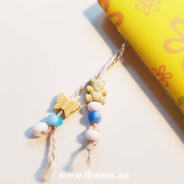 Bead dangle decoration on the yellow doodle book with blank pages | journal 26 in iHanna’s Journal release 3 2021