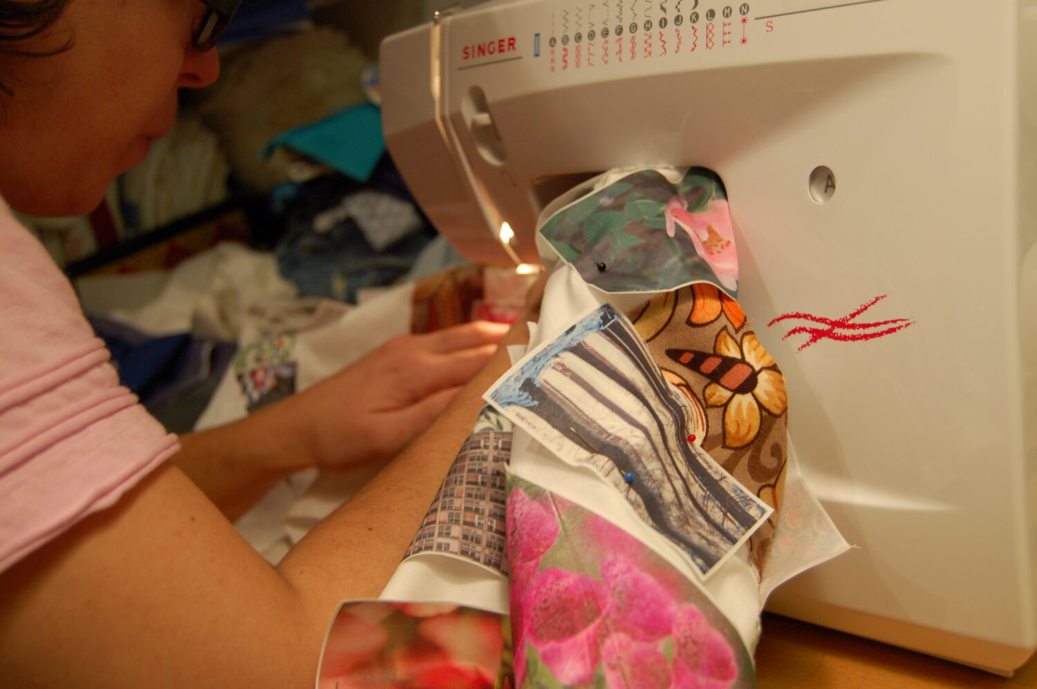 Mew sewing the collage of images for the Photo Quilt of Inspiration together (Photo Copyright Hanna Andersson)