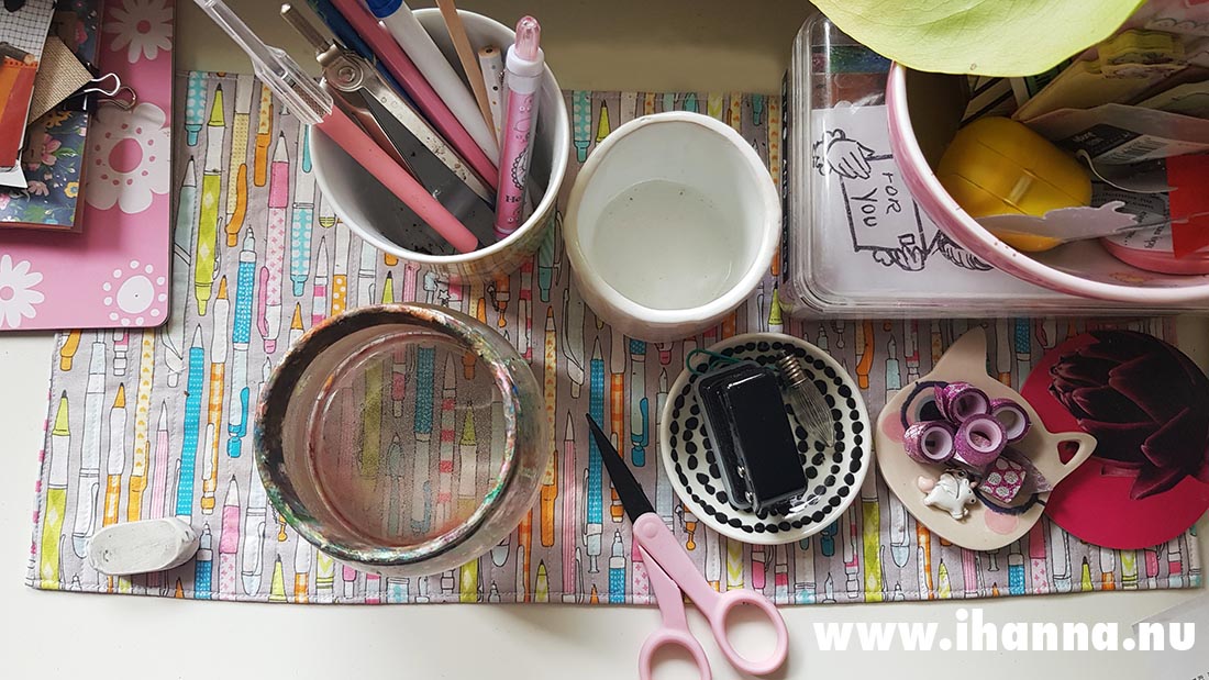 My table 2021 with table cloth of pens, water for painting and some tapes ready to be used (Photo copyright Hanna Andersson)
